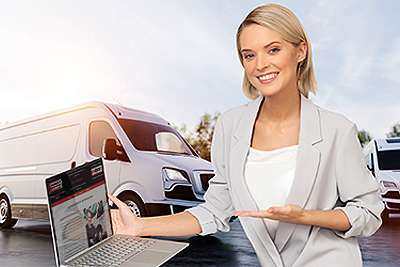 Fleet Vehicle manager holding laptop in Townsville