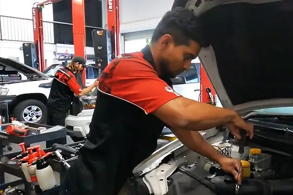 mechanic servicing a car engine in South Townsville workshop