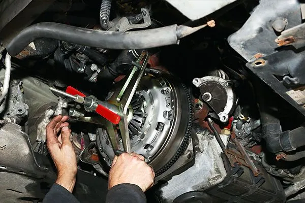 Mechanic repairs gearbox service on a 4wd car in Townsville garage