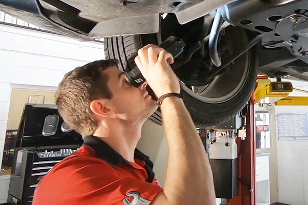 mechanic inspecting car for servicing at Townsville garage