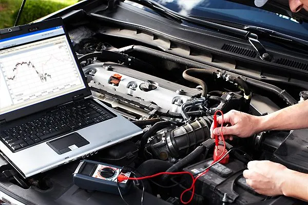 Auto electrician tests 4wd car battery at Townsville