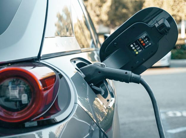 electric vehicle being charged by a townsville mechanic workshop